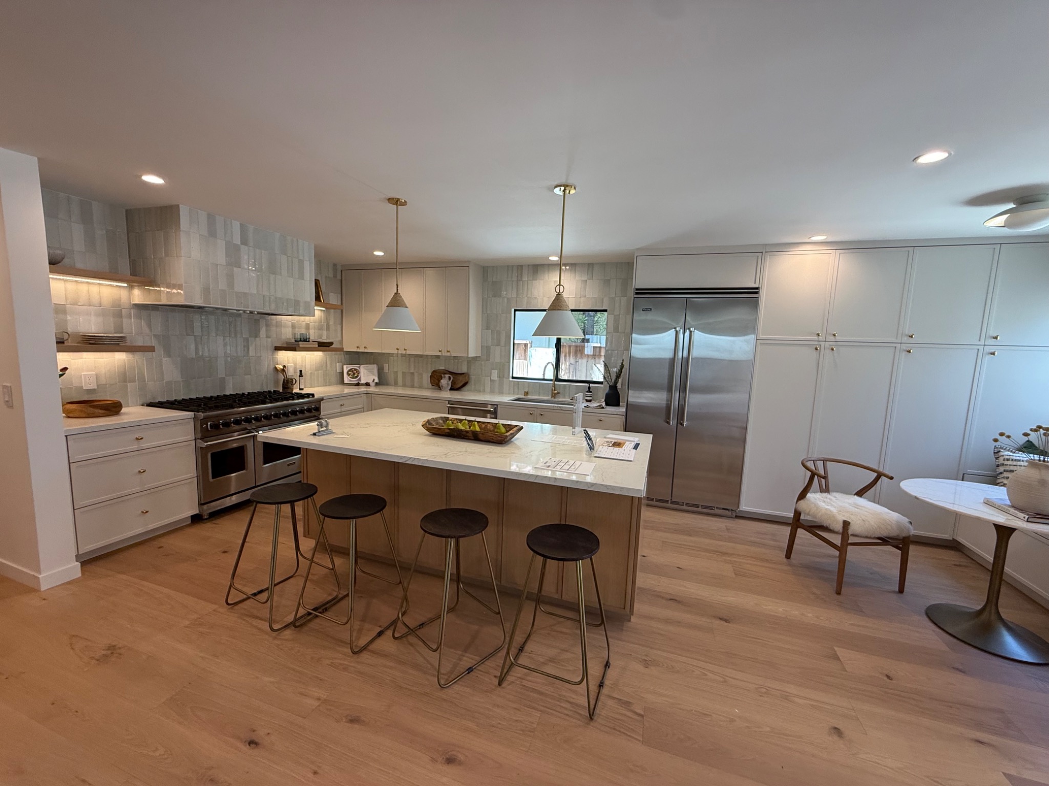 Custom kitchen with island and full-height cabinetry